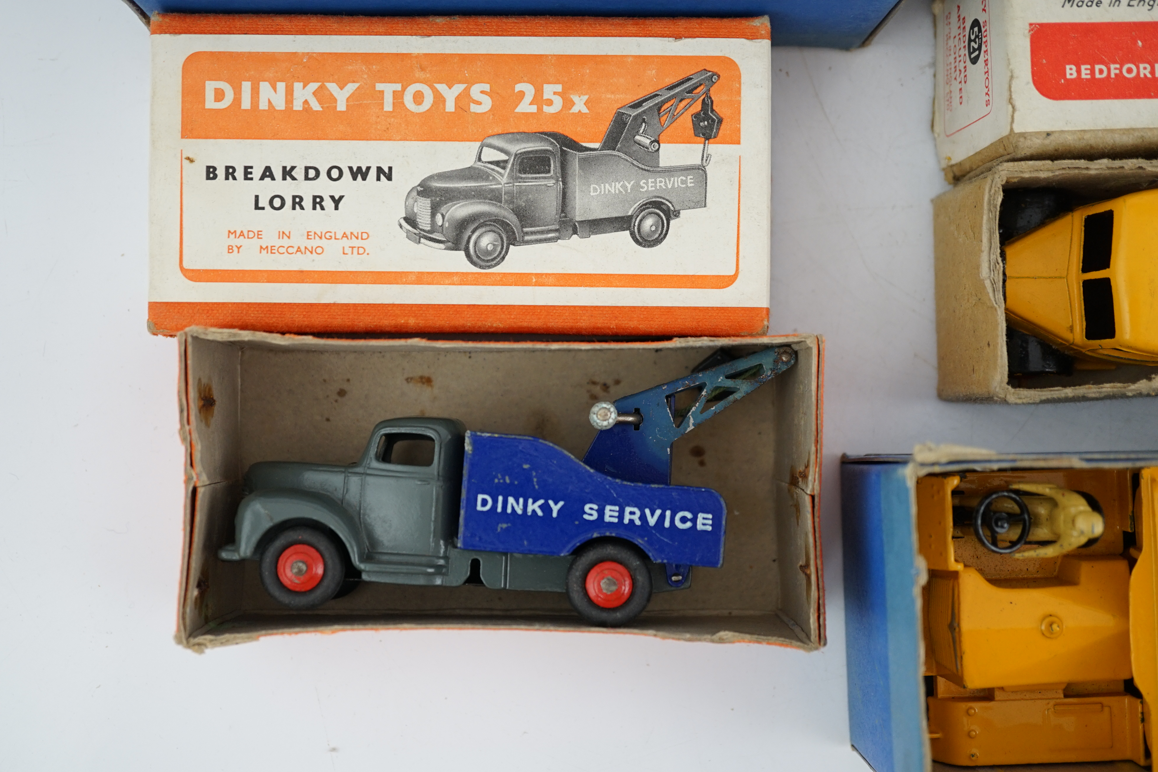 Five boxed Dinky Supertoys and Dinky Toys; a Breakdown Lorry (25x) dark grey with dark blue back, a Bedford Articulated Lorry (521) in yellow, a Blaw Knox Bulldozer (561) In red with green rubber tracks, a Dumper Truck (